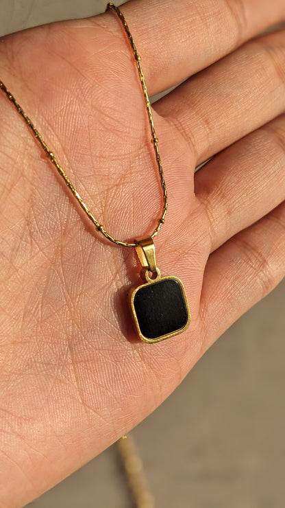 TWO SIDED BLACK SQUARE PENDANT